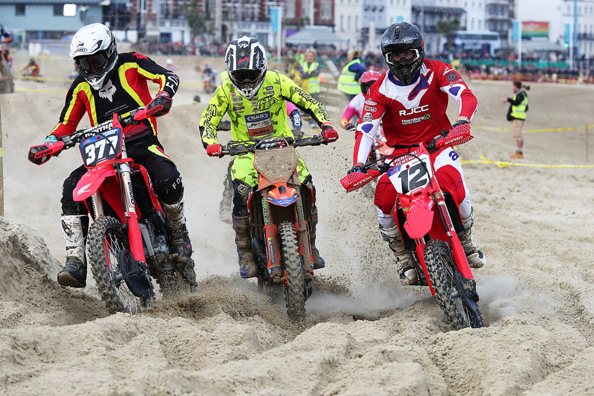 Riders competing at Weymouth Beach Motocross on the Dorset coast