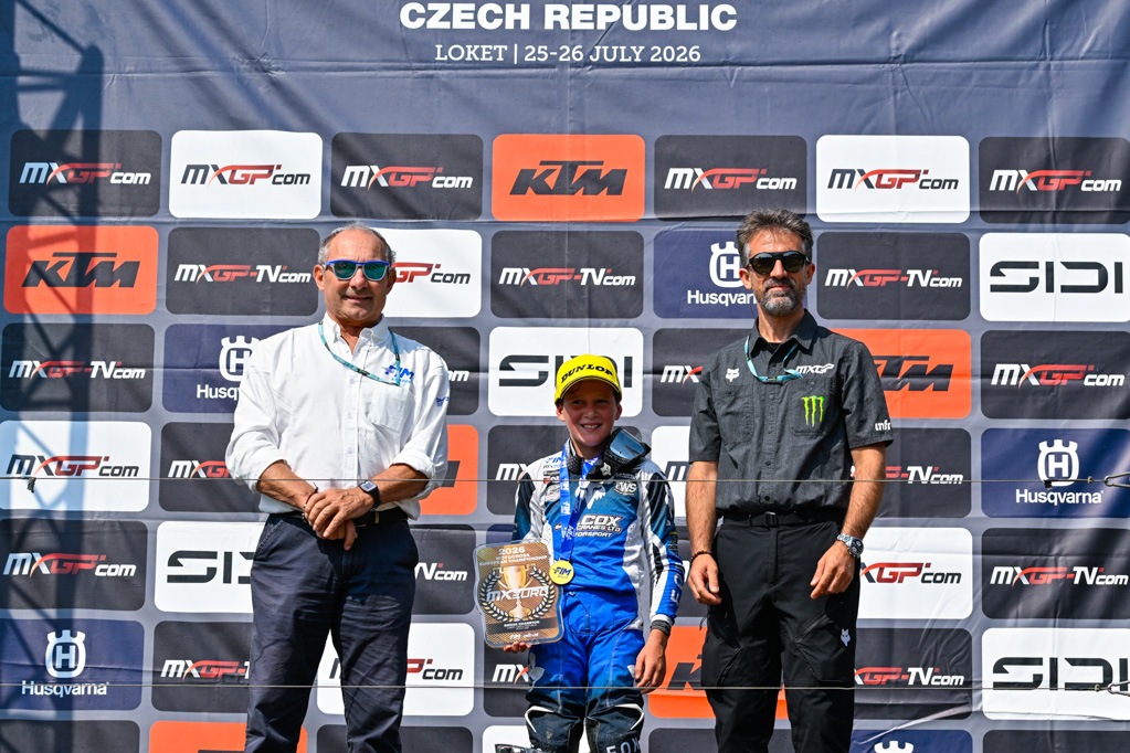 Jack Waters celebrates after becoming the first British rider to win the EMX65 European Motocross Championship at Loket.